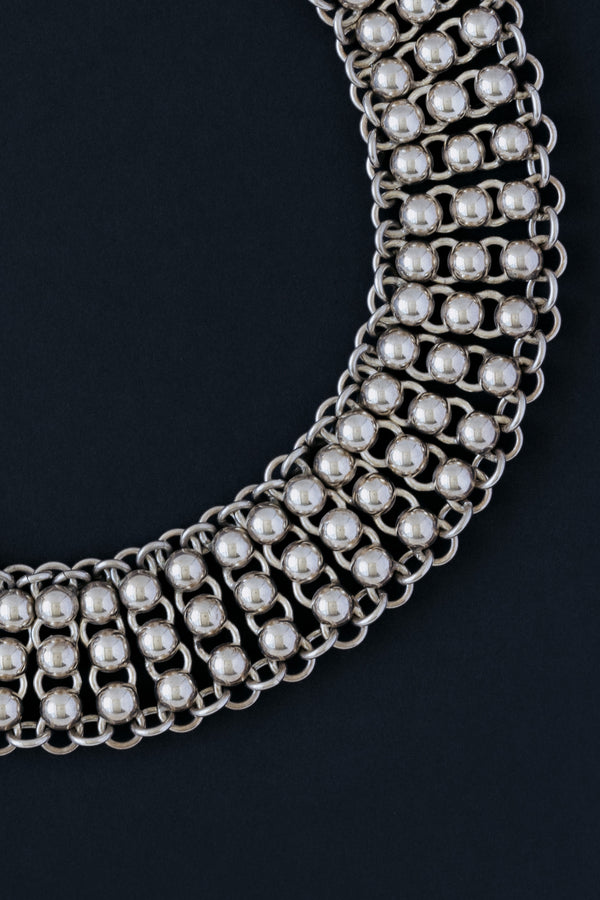 Close up of vintage Mexican sterling silver ball and link collar necklace