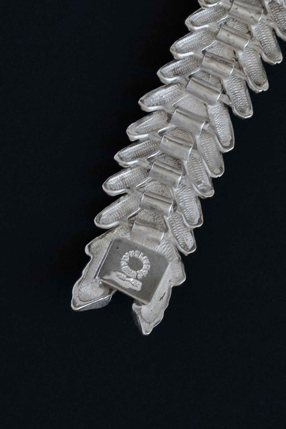 Close-up of TM-90 D'Molina Mex 925 hallmark stamp on sterling silver