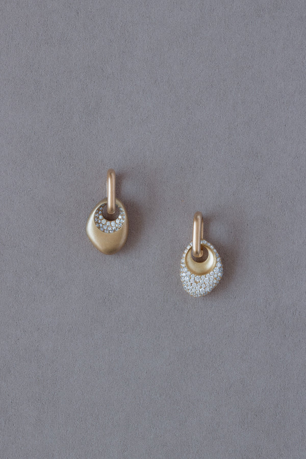 Pair of 18k Gold Egg Shaped Drop Earrings  set with white diamonds on a grey background
