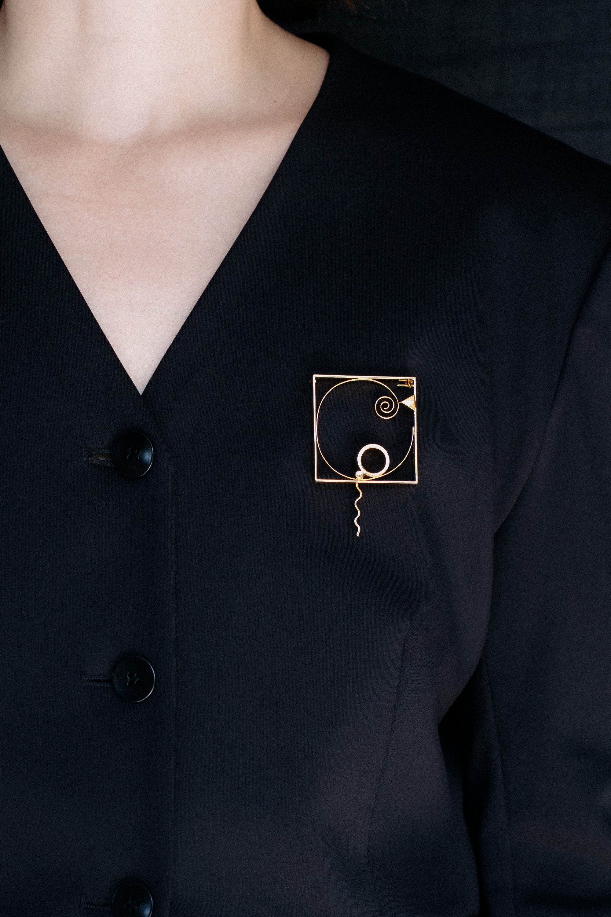 Fletcher Benton pin on blazer model
