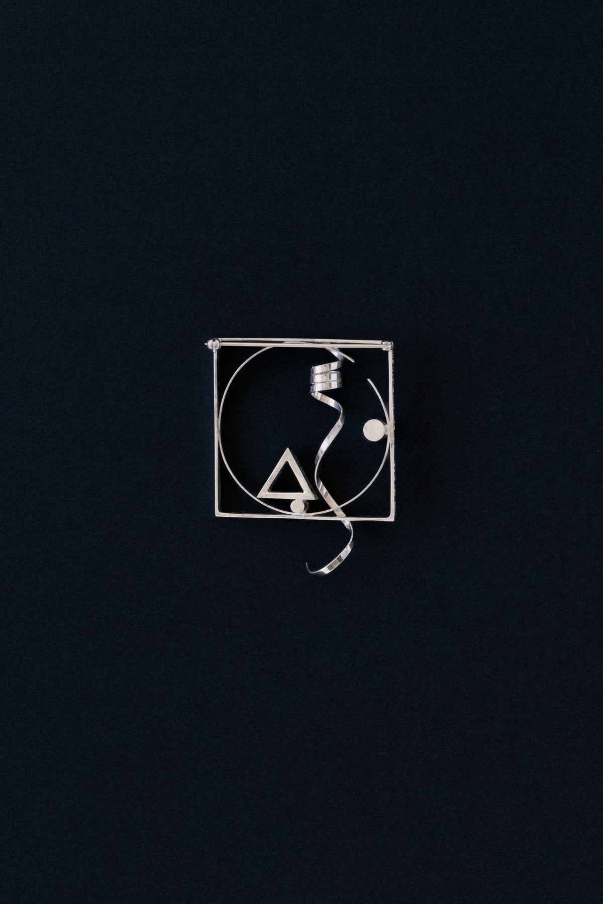 Fletcher Benton sterling silver square frame brooch with twisted ribbon, 1986, front view