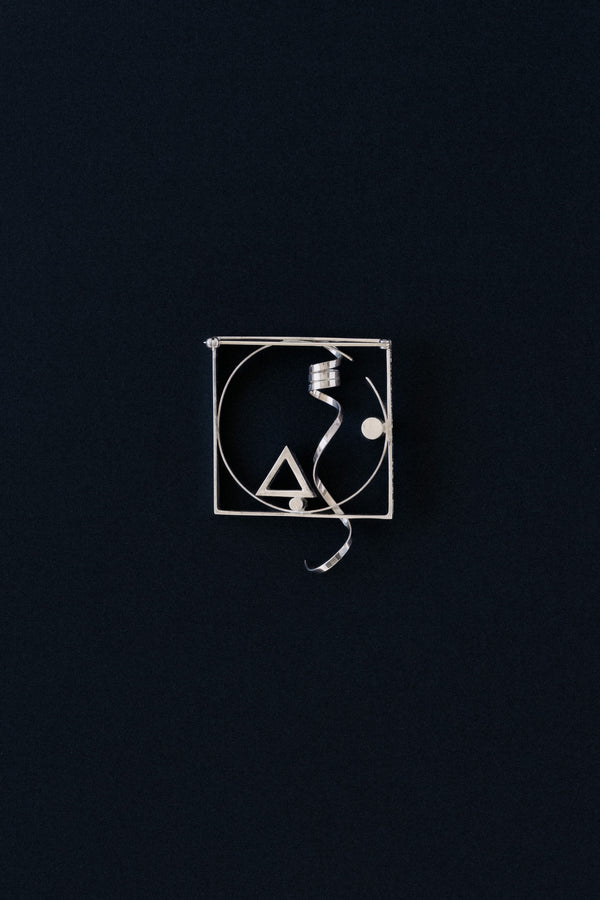 Fletcher Benton sterling silver square frame brooch with twisted ribbon, 1986, front view
