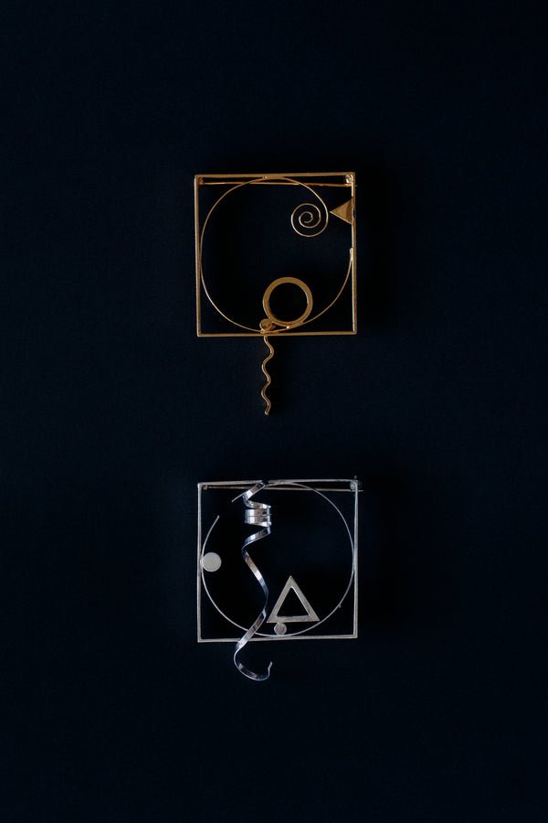 letcher Benton sterling silver and gold vermeil square frame brooches with twisted ribbon, 1986, front view