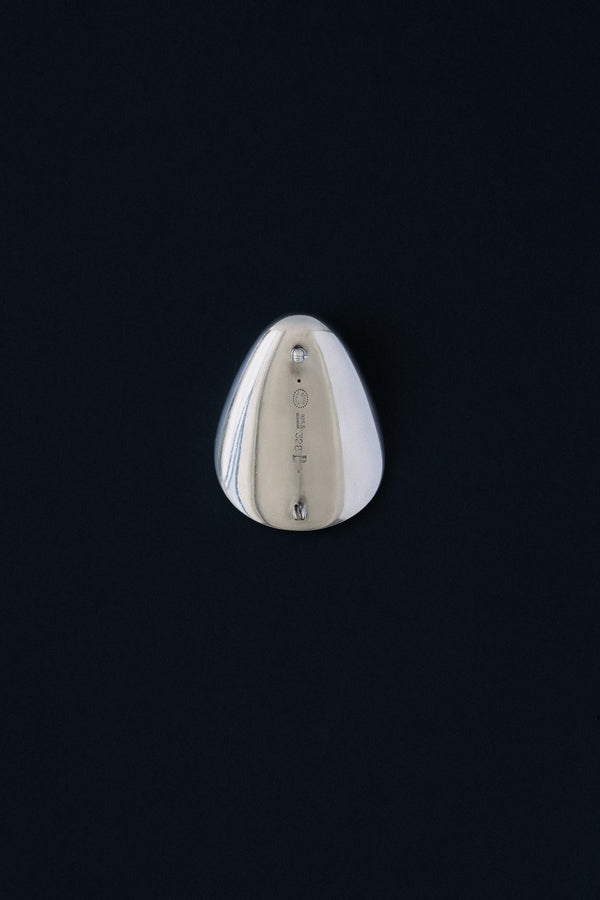 Close-up of Georg Jensen hallmark, 925 S, Denmark, 328, NJ stamped on sterling silver brooch