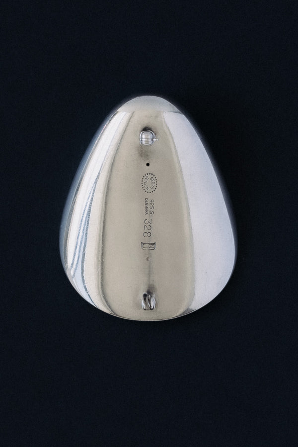 Close-up of Georg Jensen hallmark, 925 S, Denmark, 328, NJ stamped on sterling silver brooch