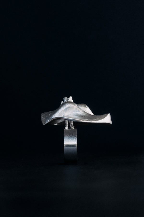 Side view of Björn Weckström Lapponia sterling silver statement ring showing small person