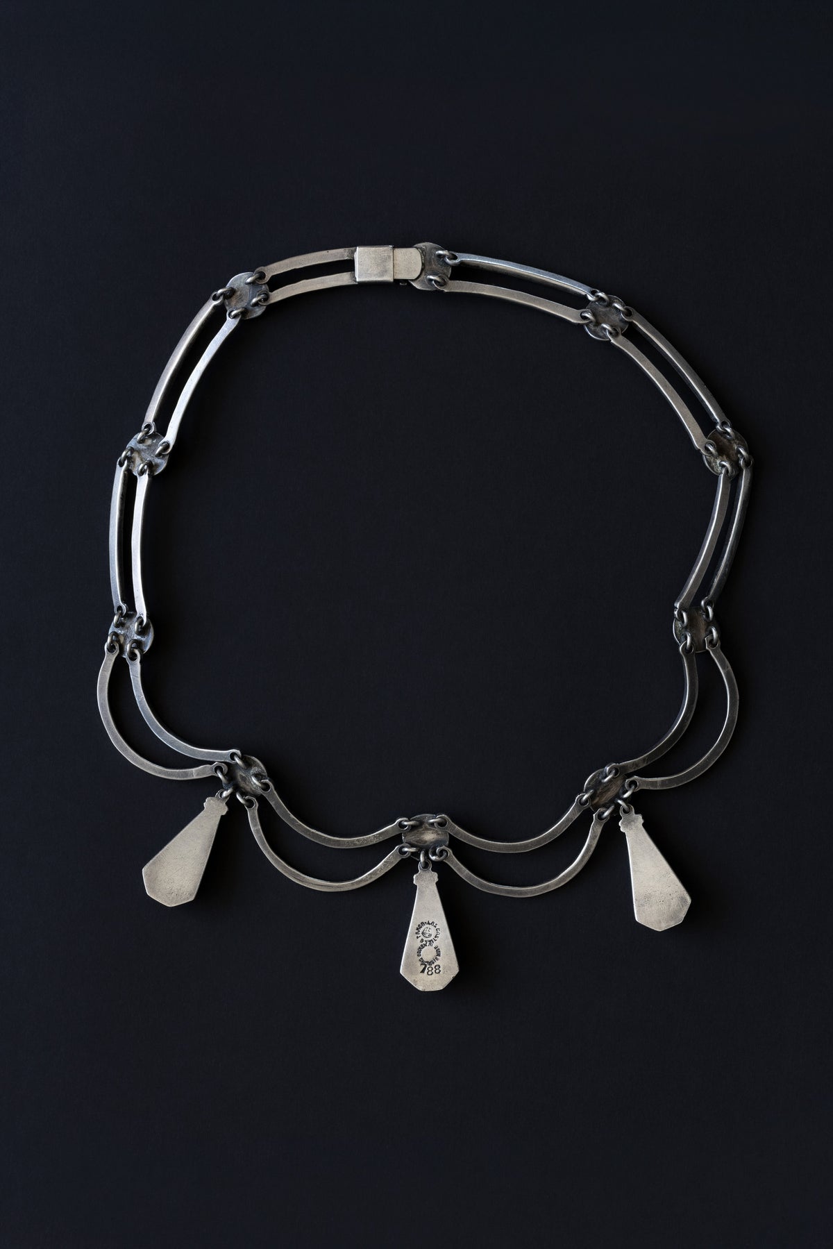 Reverse view of Los Castillo Taxco sterling silver pendulum necklace showing link construction and clasp