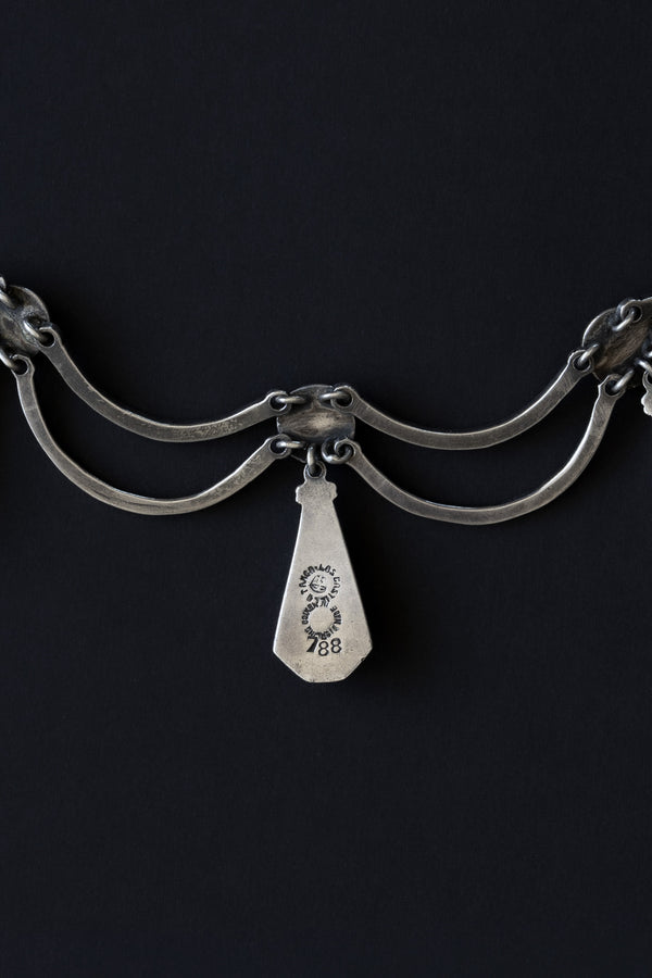 Close-up of Los Castillo Taxco hallmark, design number 788, and Mexican eagle assay stamp on sterling silver