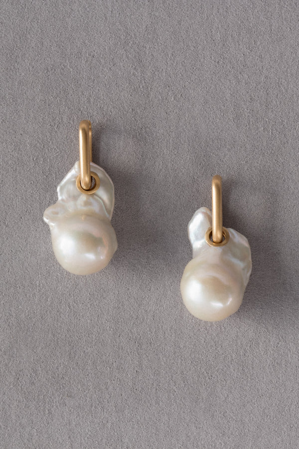 Ouvelle Mother of Pearl Fireball Earrings Gold on Grey Background