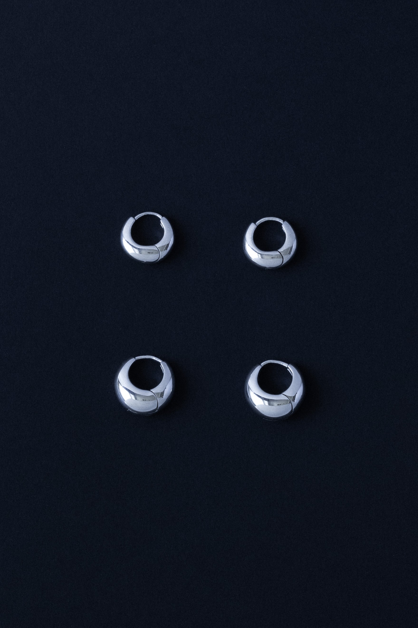 Ouvelle Daily Egg Hoops Silver Small & Medium on Black Background