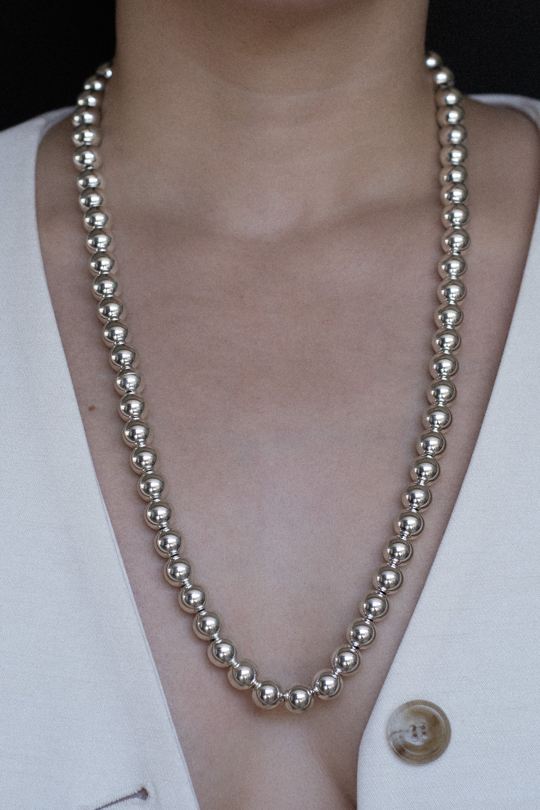 Long silver beaded necklace with magnetic clasp model