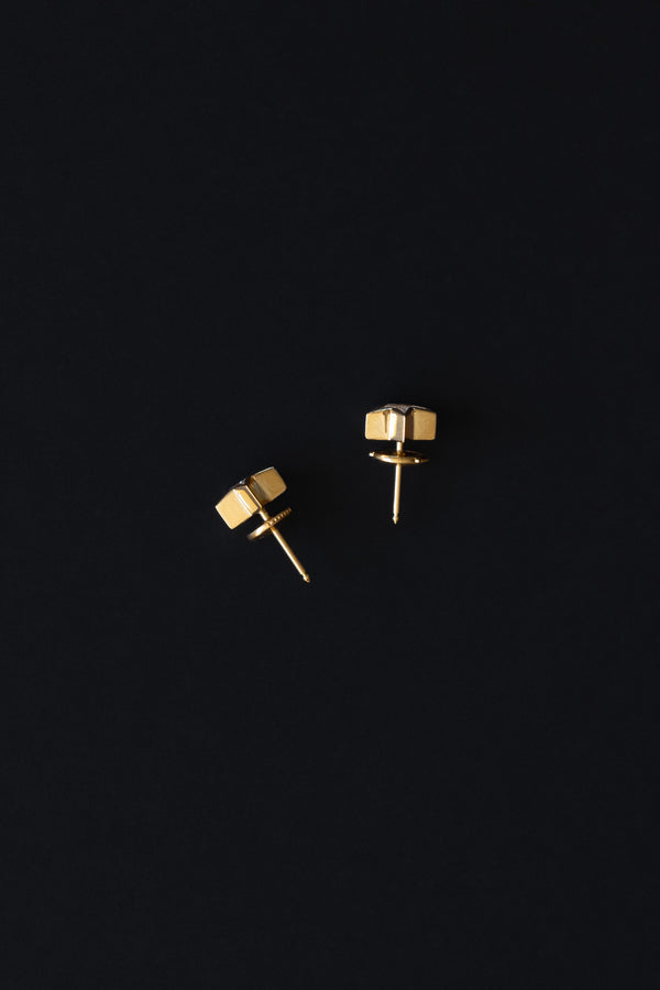 Ouvelle Custom cut star shaped white diamond earrings set in 18 karat yellow gold side view on black backgroun