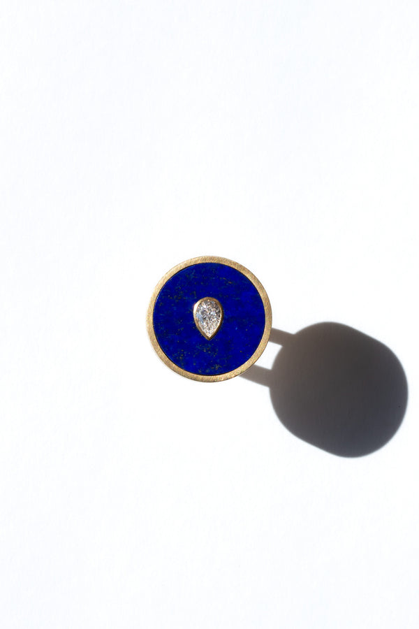 Seed ring representing moment of conception 18k yellow gold and pear shaped diamond set in Lapis inlay by Ouvelle