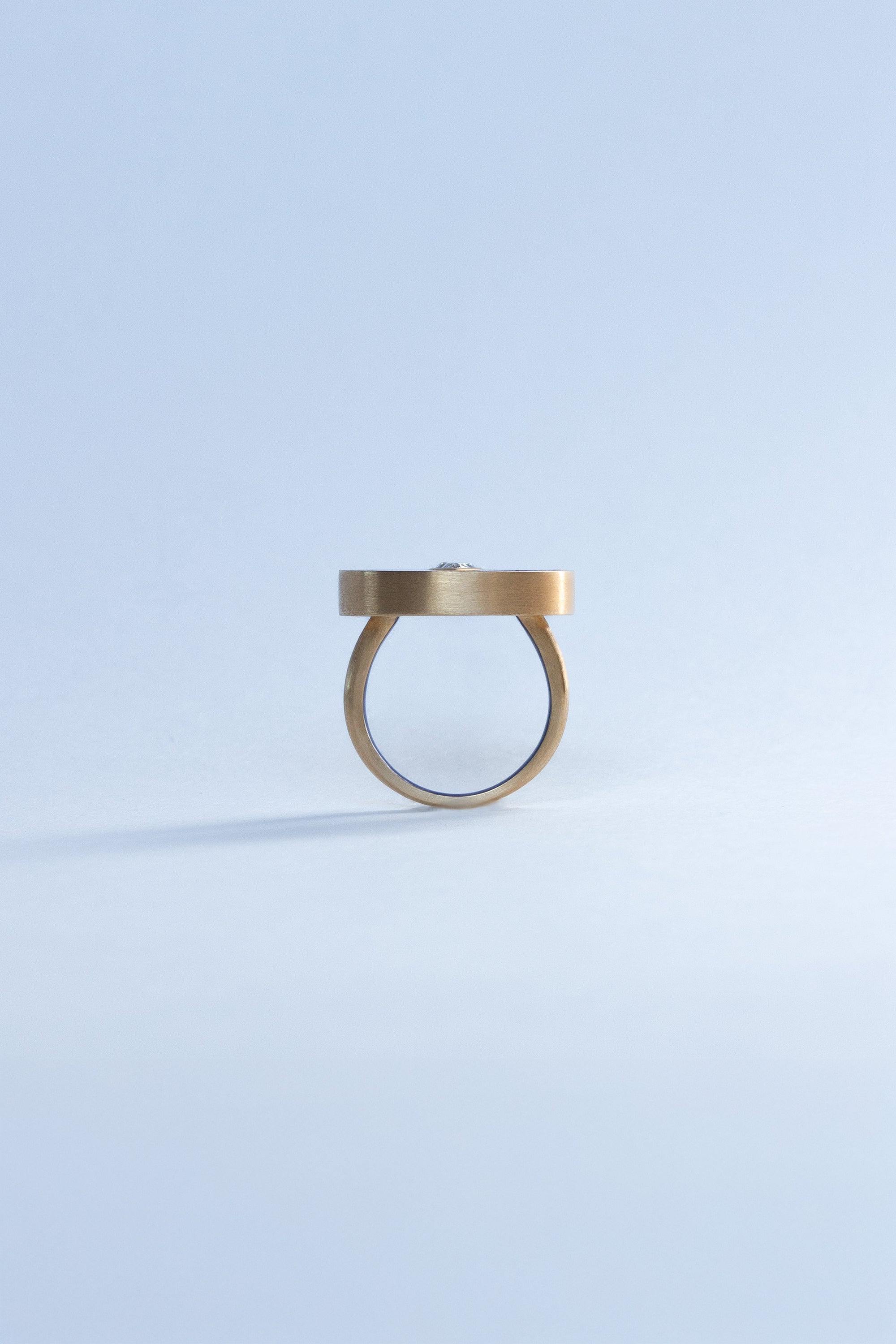 Seed ring representing moment of conception 18k yellow gold and pear shaped diamond set in Lapis inlay by Ouvelle side view Side View