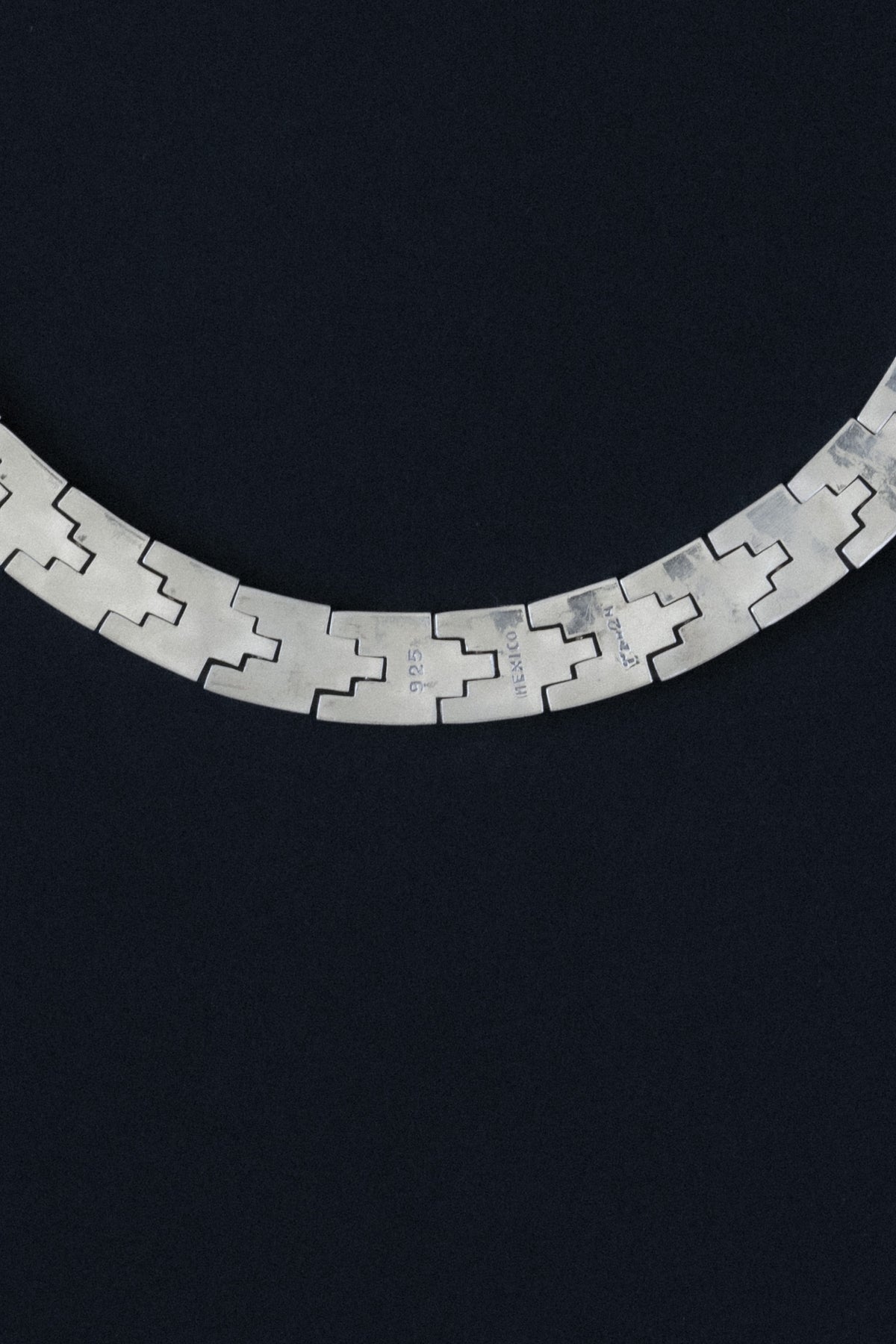 Close-up of 925, Mexico, and TR-24 hallmarks on Taxco silver necklace