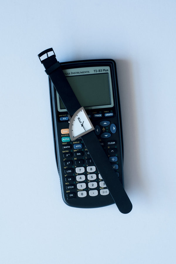 Brodmann Segments by Ventura quarter-arc steel watch on a Ti-83 calculator